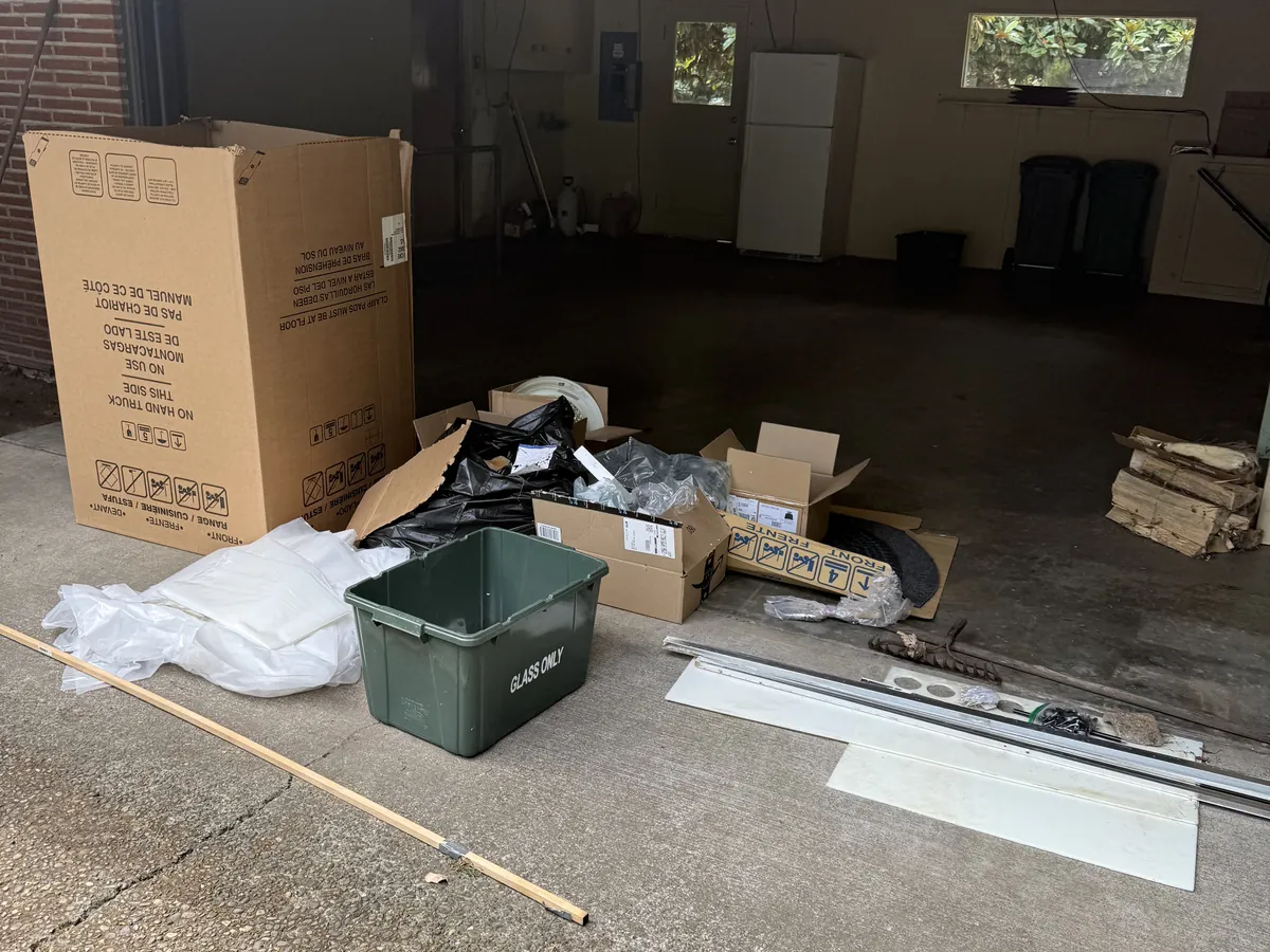 Garage with boxes and unwanted items before removal